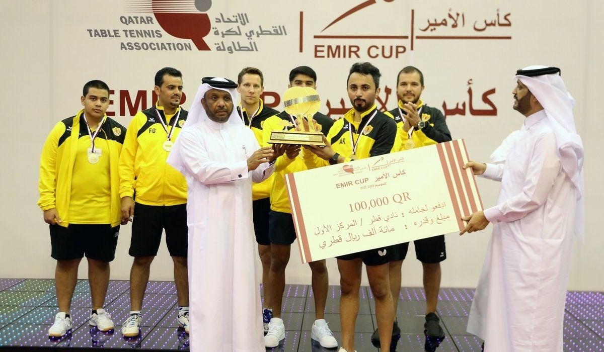 Team mates of Qatar Sports Club poses with the title
